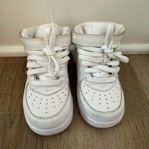 Nike Air Force ones, white.